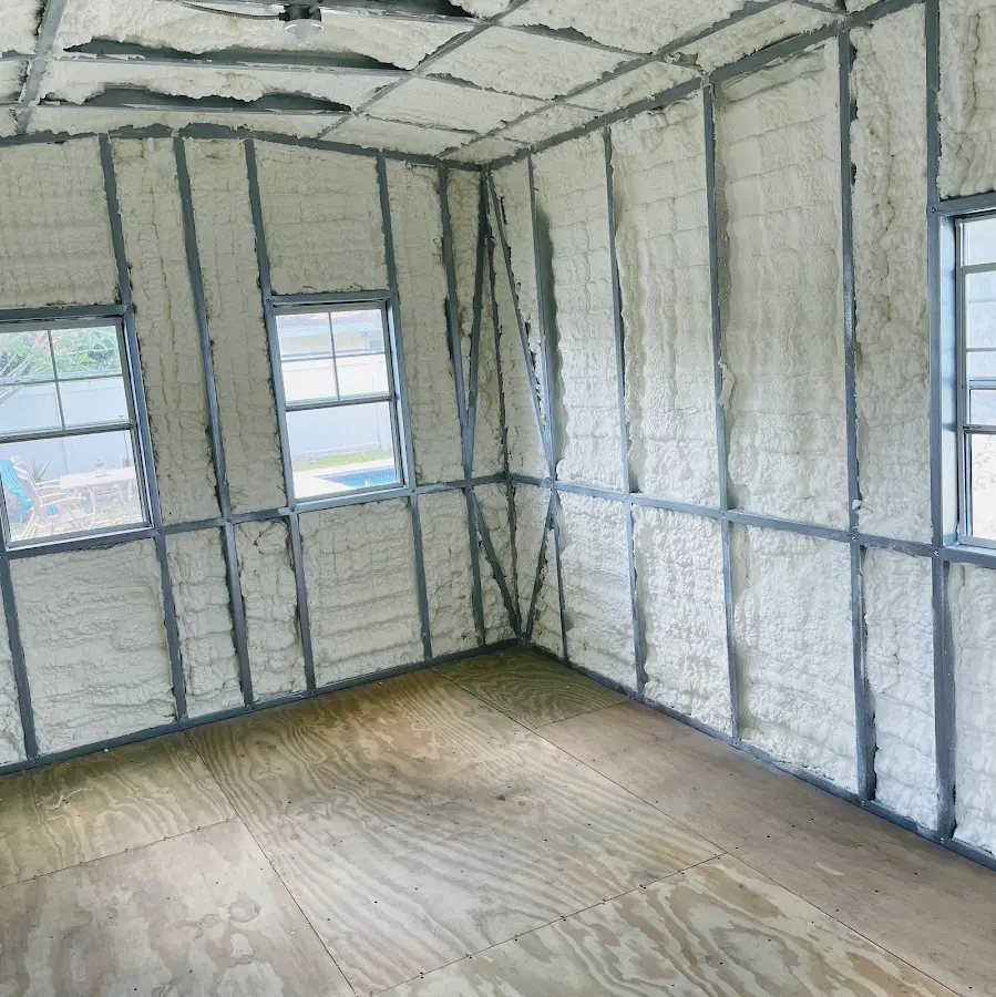 Closed-cell spray foam insulation applied to wall cavities in a residential project in Fircrest